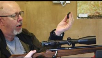 Anschutz 1416 Bolt Action .22LR rifle with Hausken sound moderator and Docter optic.