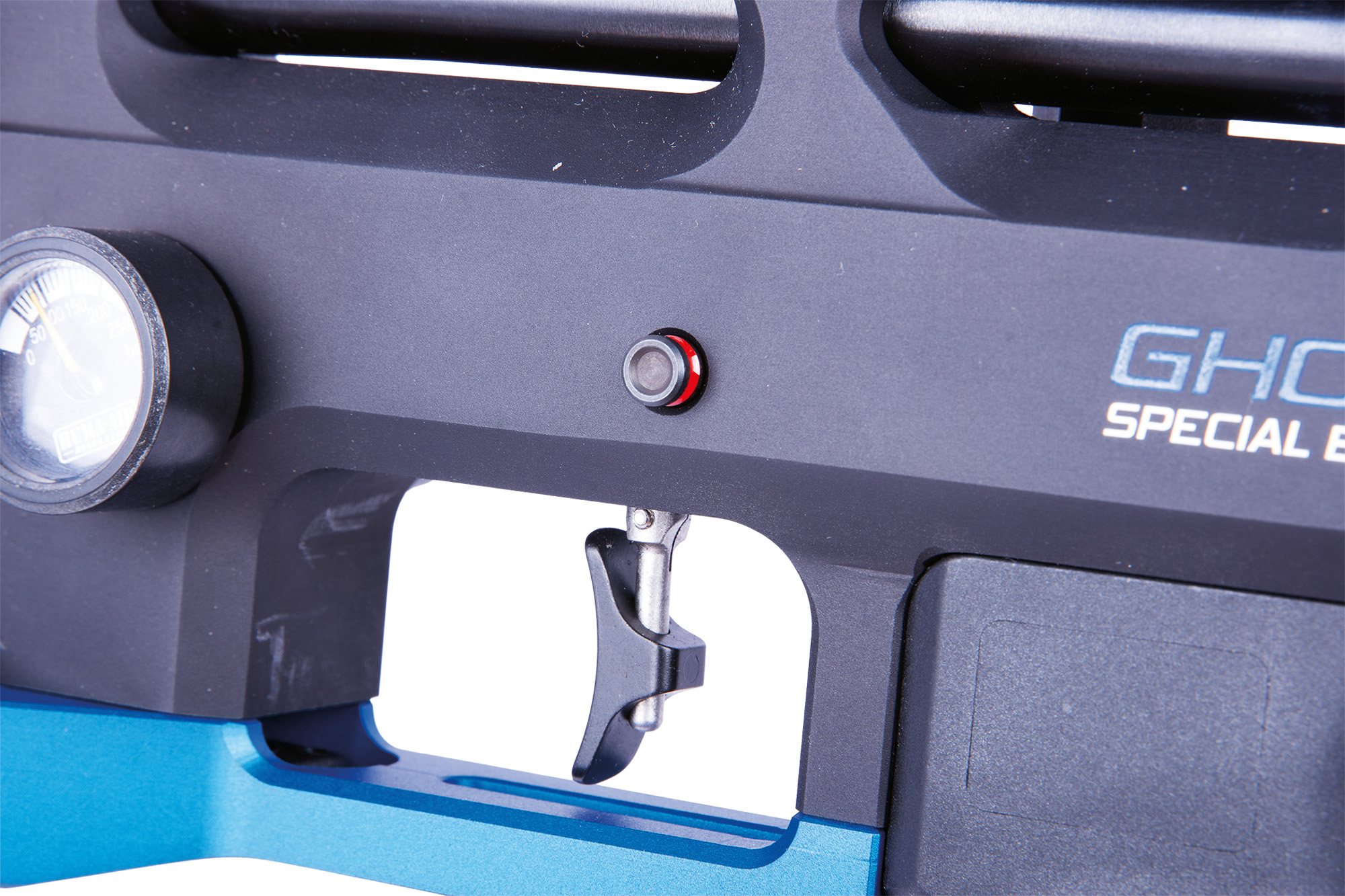 The push-button safety catch located below the side-lever.