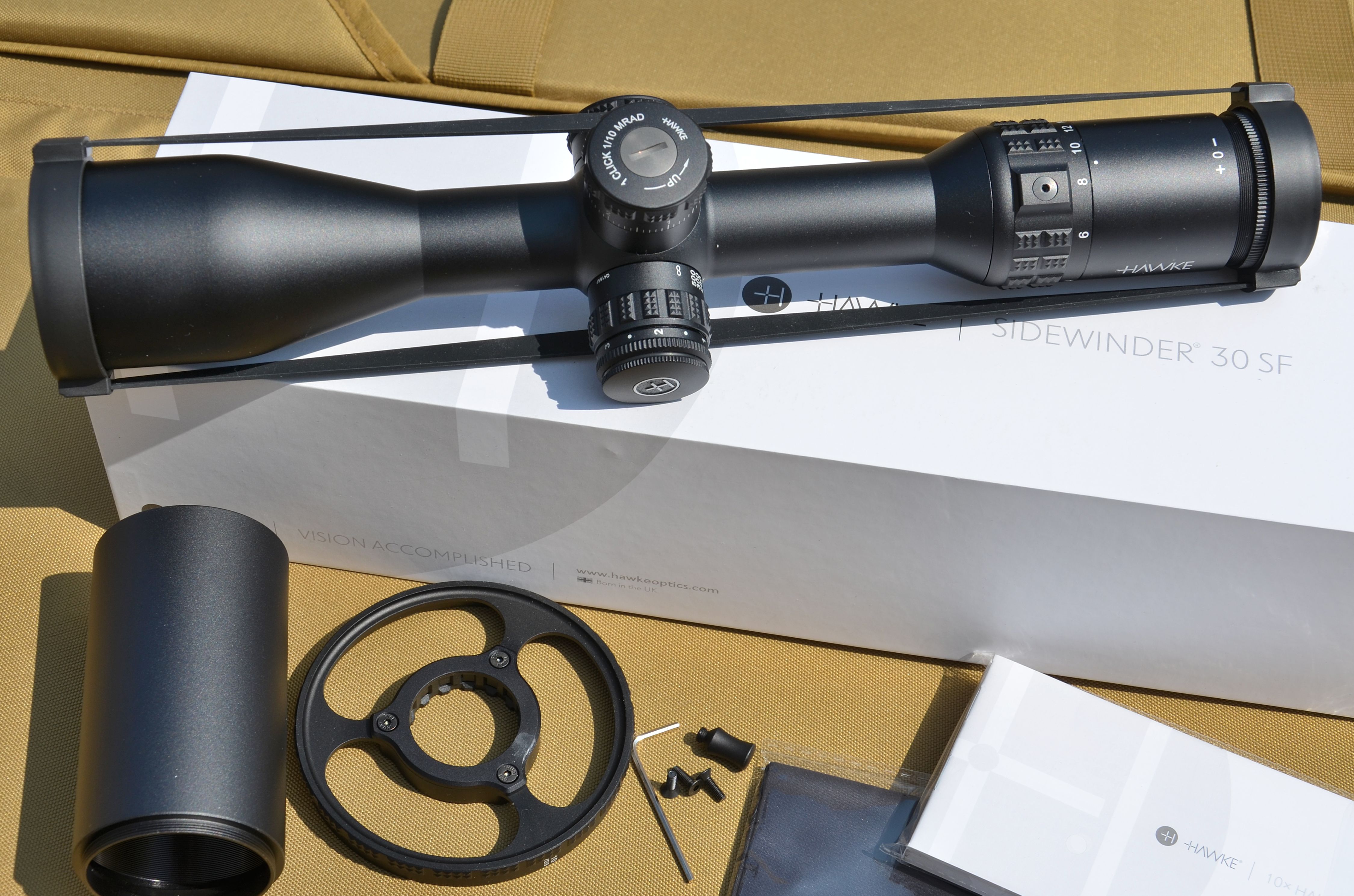 The full set of accessories included with the Hawke Sidewinder 30 scope.
