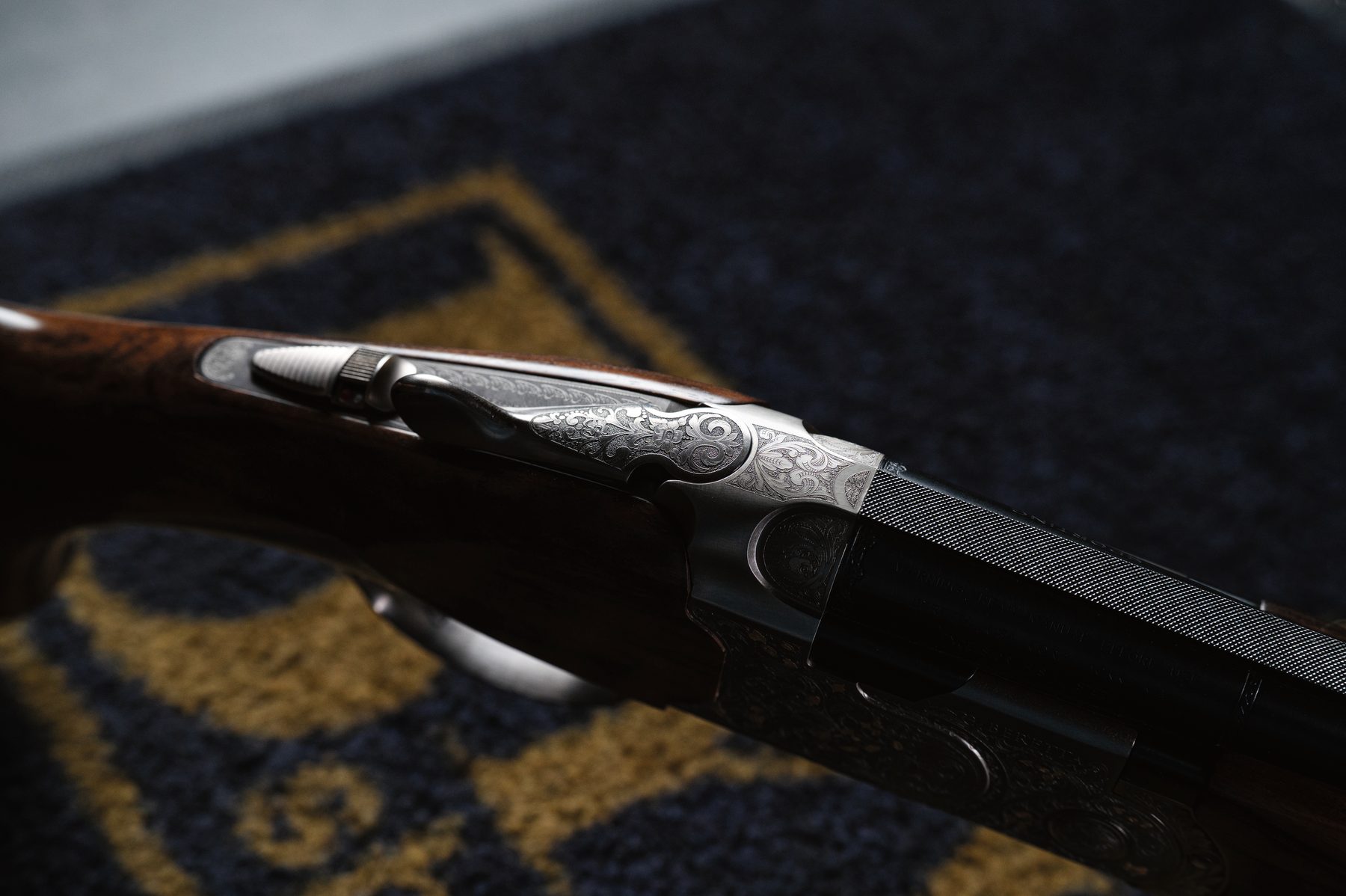 The fore-end iron and action of the Beretta 687 500 Years LE from the underside, showing the engraving