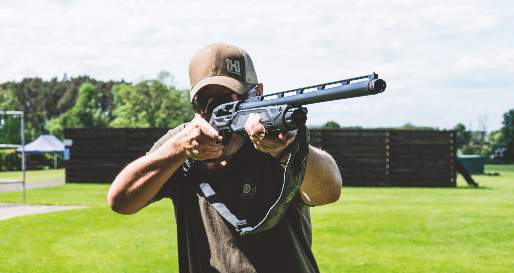 Shooter mounting the Beretta AX800 Suprema at a shooting ground