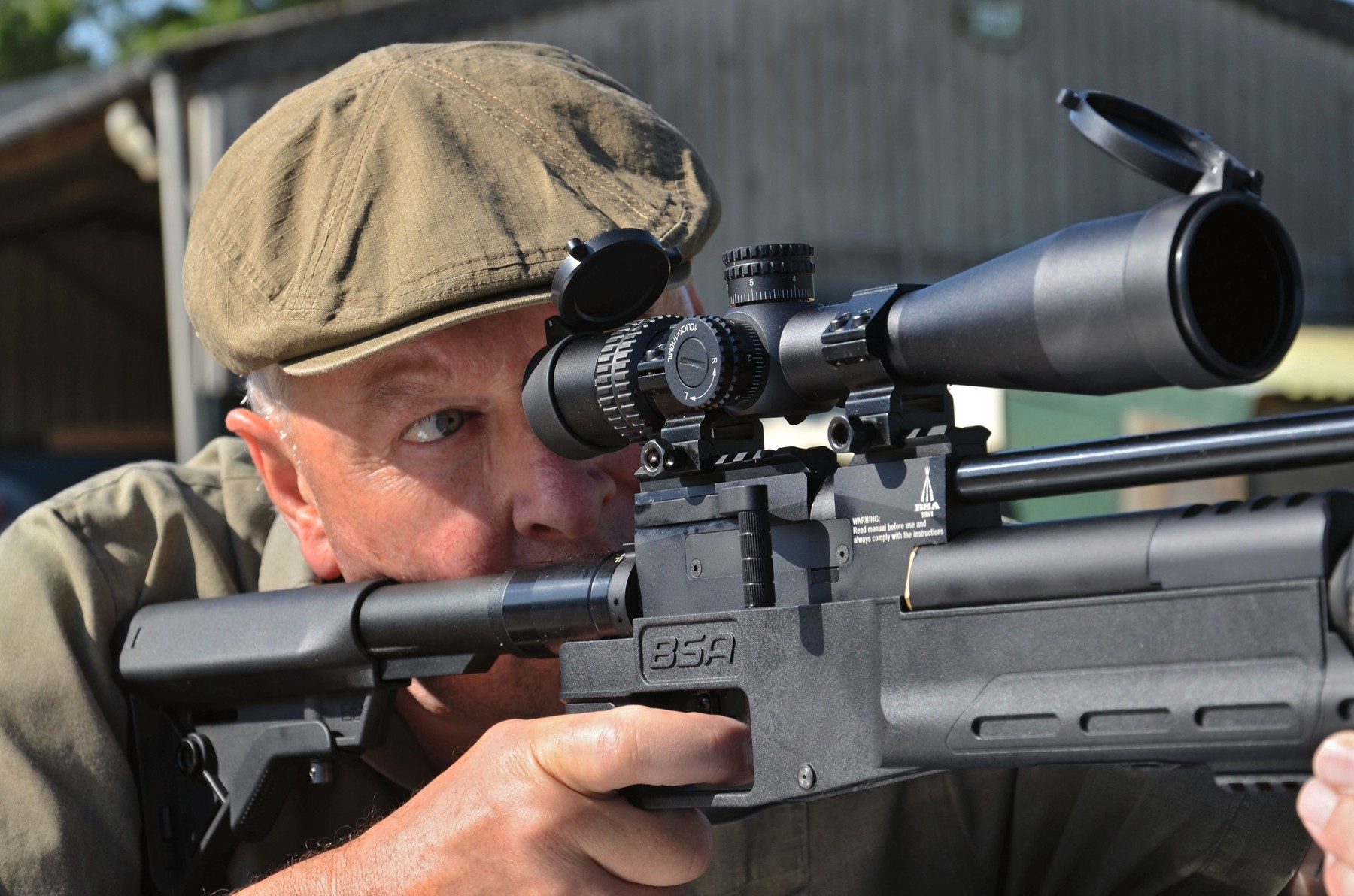 A shooter with cheek on the adjustable rear stock of the BSA XT-SL tactical air rifle