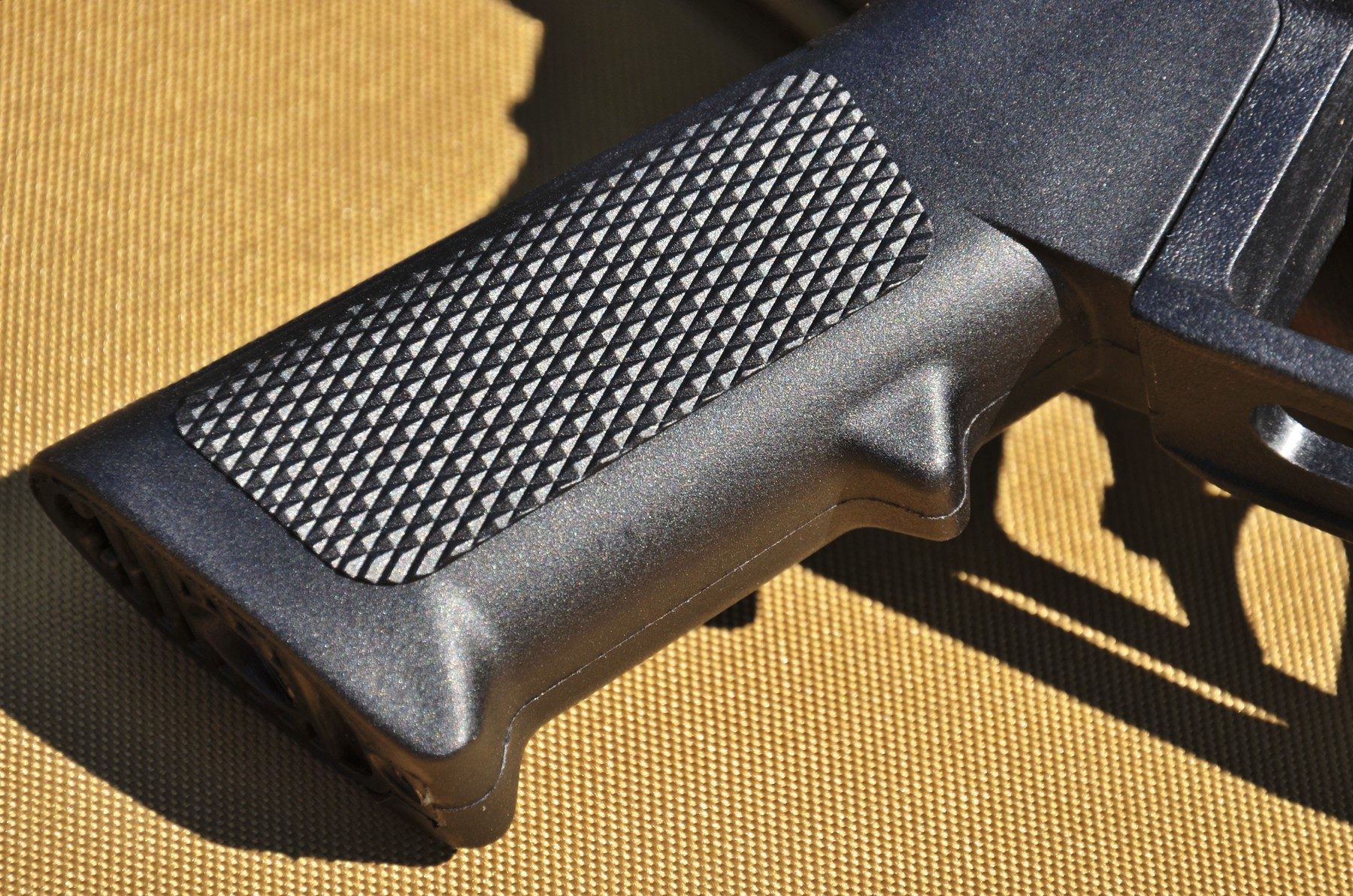Detail of the moulded and stippled pistol grip on the BSA XT-SL