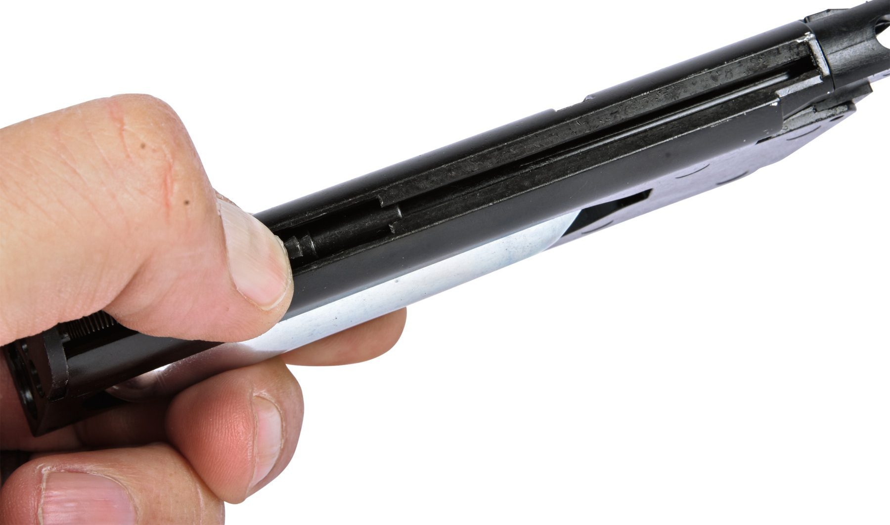 Holding the loading tab down against the spring to drop steel BBs into the ES1911 magazine