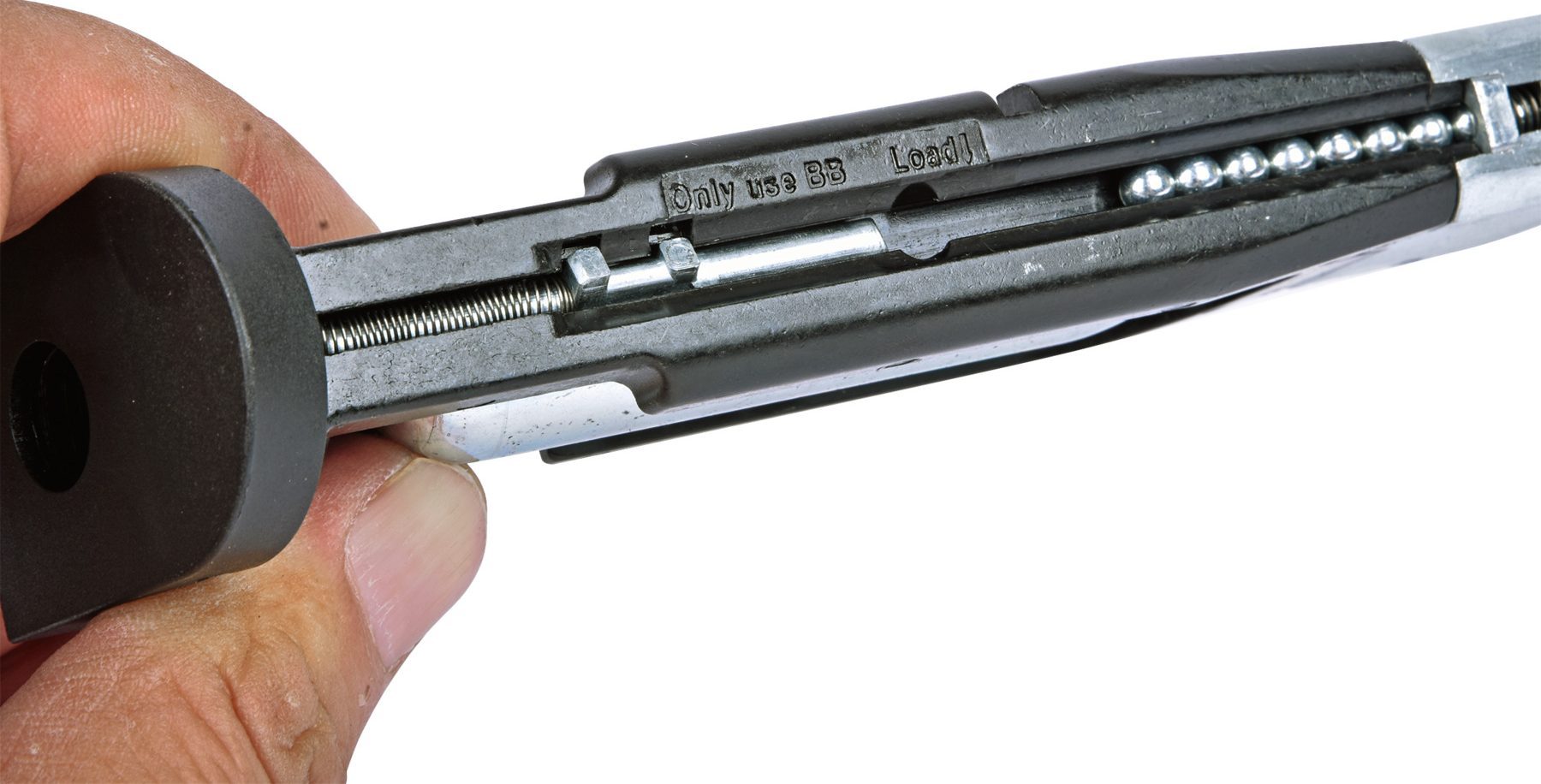 Tilting the Ekol ESP92B magazine downwards to drop steel BBs into the channel
