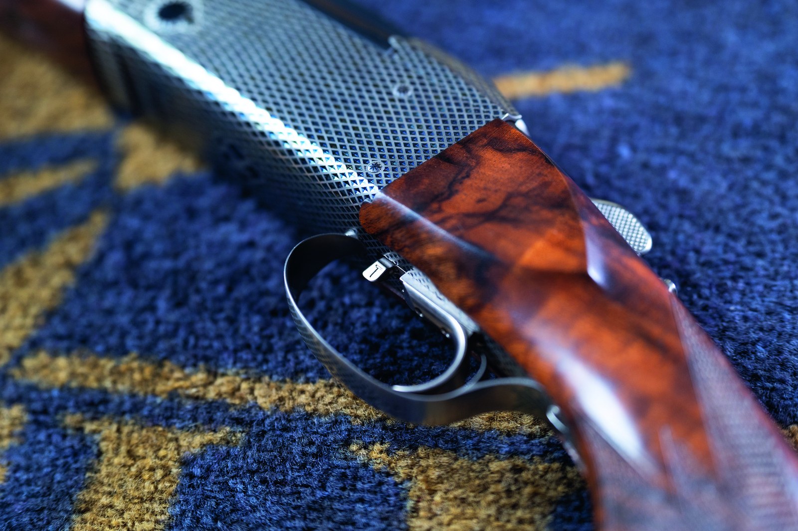 The barrel selector on a Krieghoff K-80, integrated with the trigger inside the trigger-guard