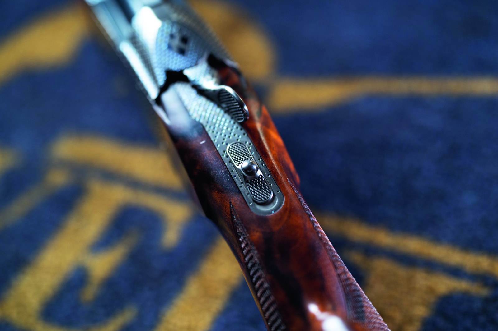 The safety on a Krieghoff K-80, with the button that prevents accidental activation