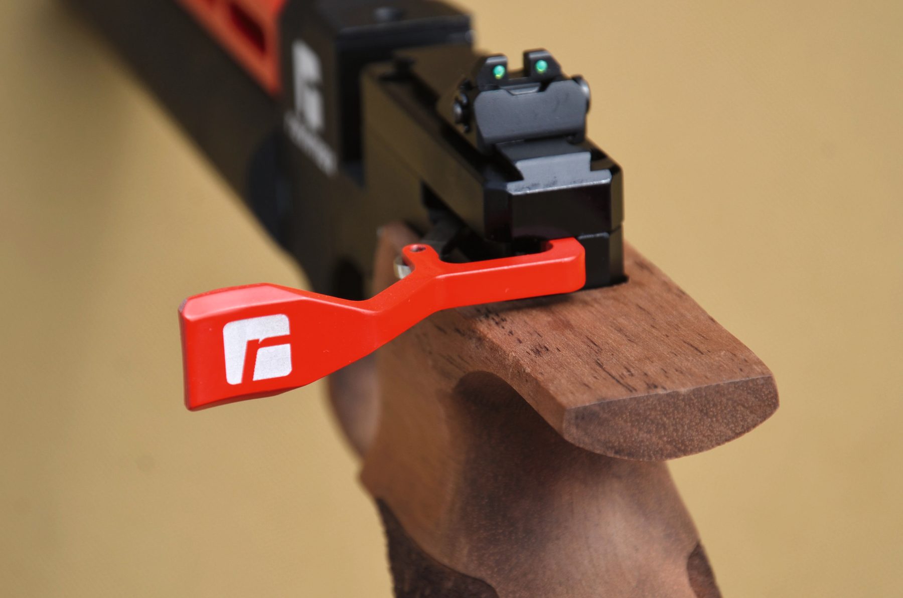 The ventilated trigger blade and manual safety button on the Reximex Mito Race