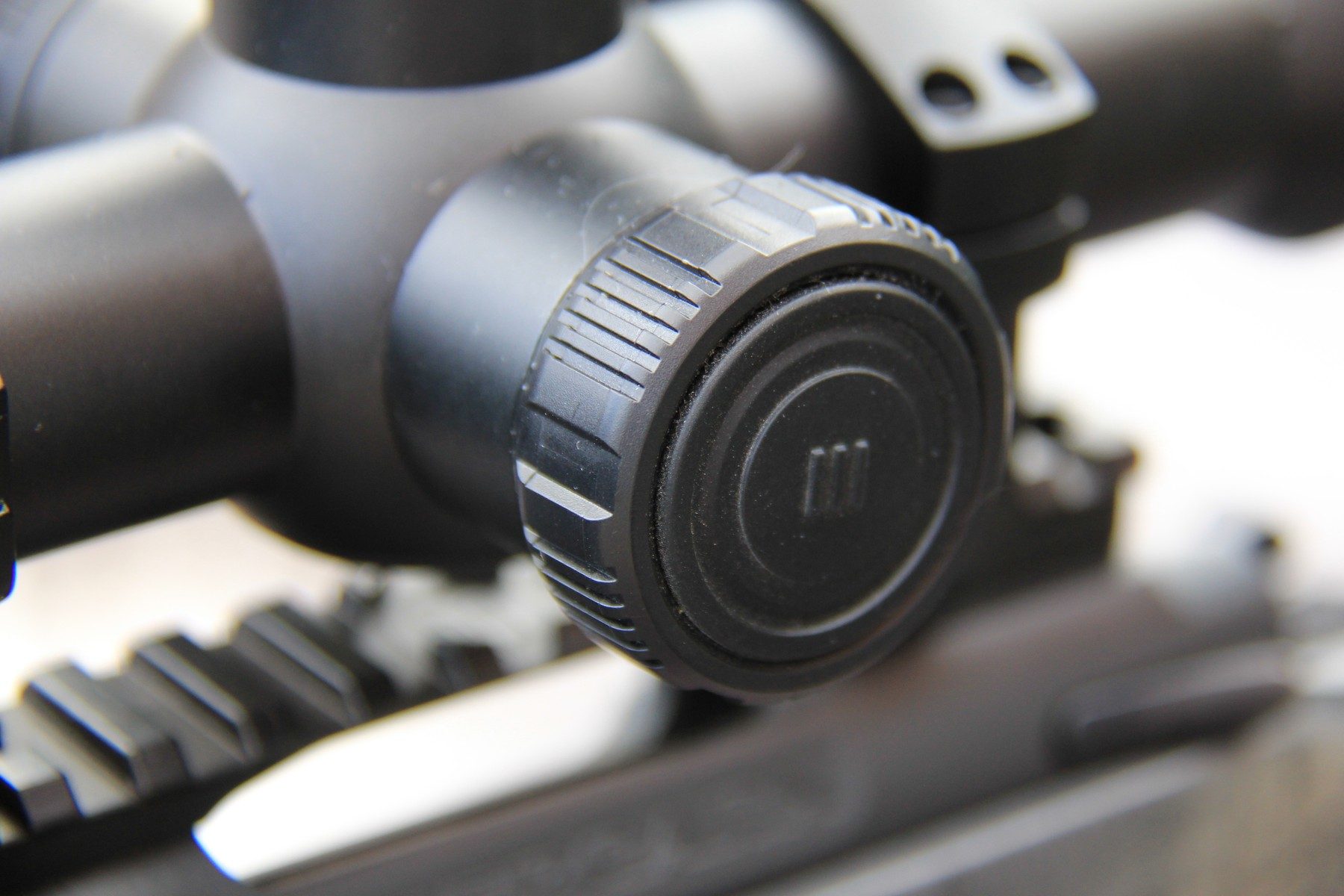 The central turret of the RIX Tourer T50 4K with its three top buttons, including the laser rangefinder