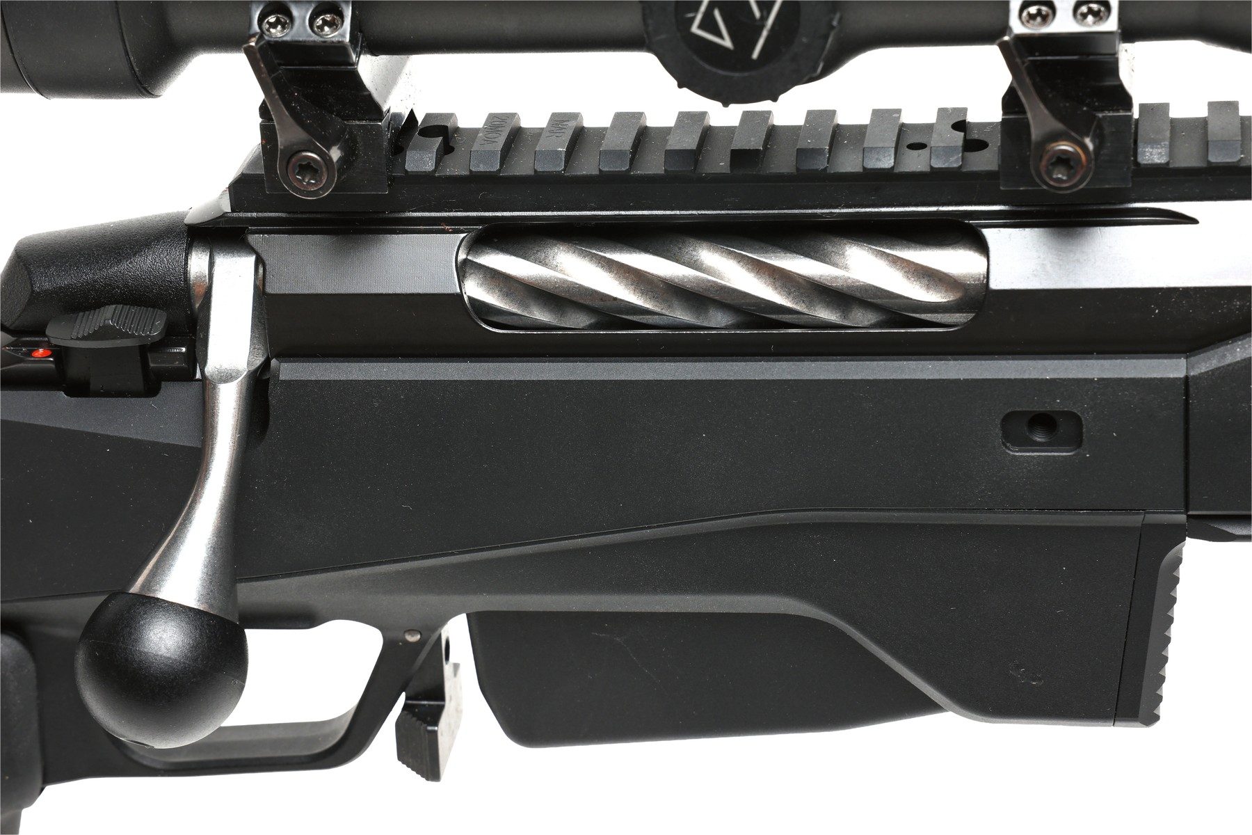 Close-up of the one-piece 20 MOA Picatinny rail and spiral-fluted bolt of the Tikka T3x Ace Game